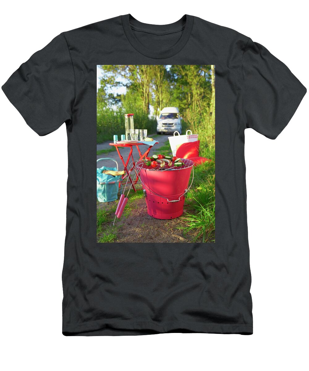 A Barbecue a Camping Table and a Basket on the Edge of a Road Jalag Olaf Szczepaniak T-Shirt