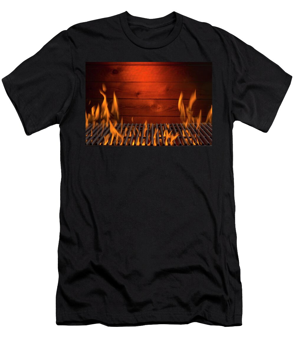 A Flaming Hot Barbecue Grill Against a Wooden Wall Brian Enright T-Shirt