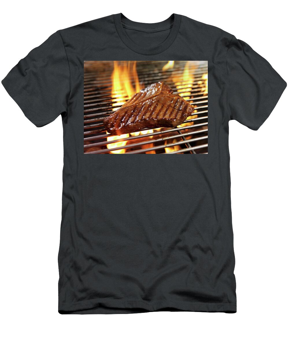 A T Bone Steak on a Barbecue Ian Garlick T-Shirt