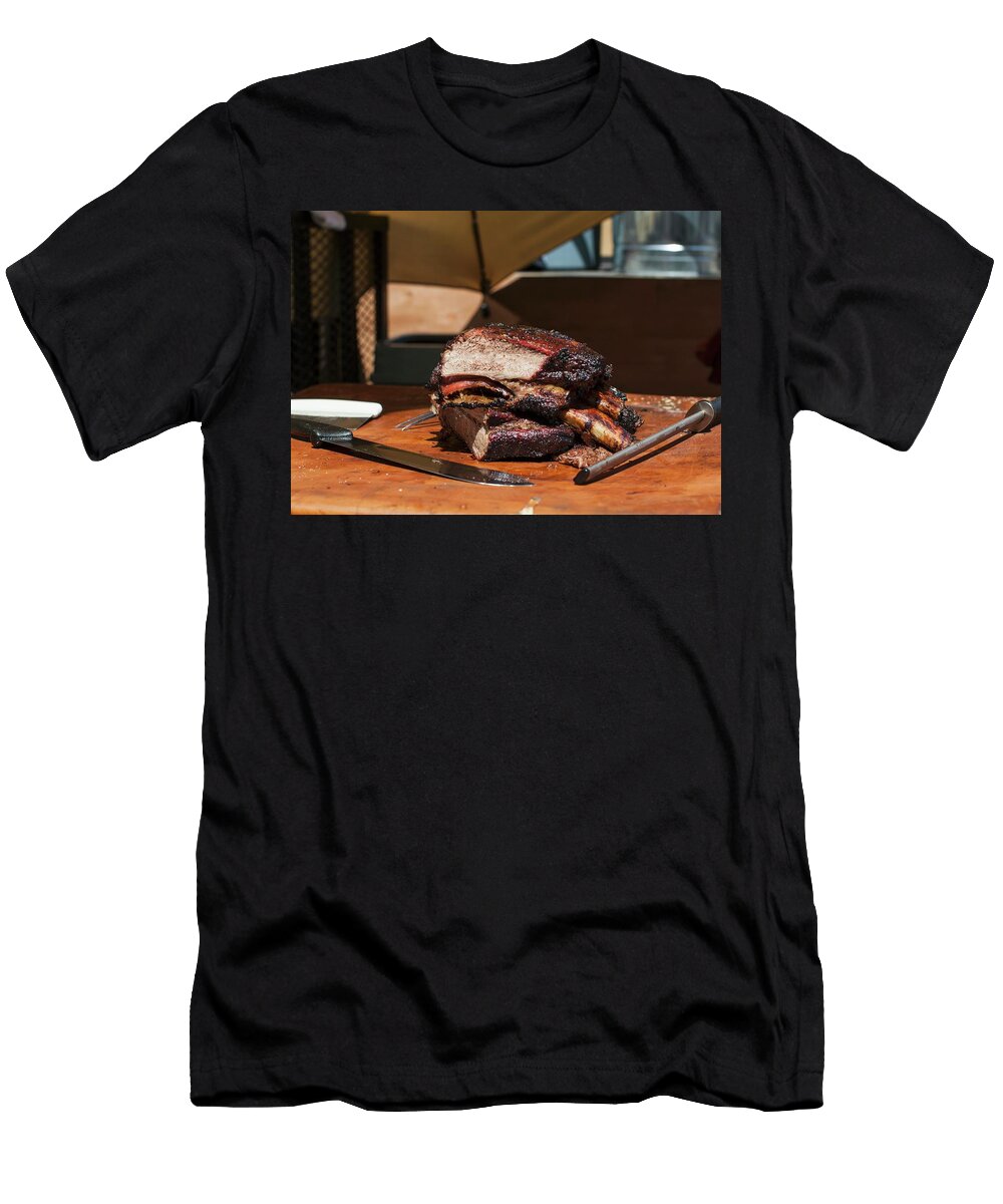 Barbequed Beef Ribs Stacked on a Cutting Block in the Sun with a Carving Knife and Sharpening Tool Don Crossland T-Shirt