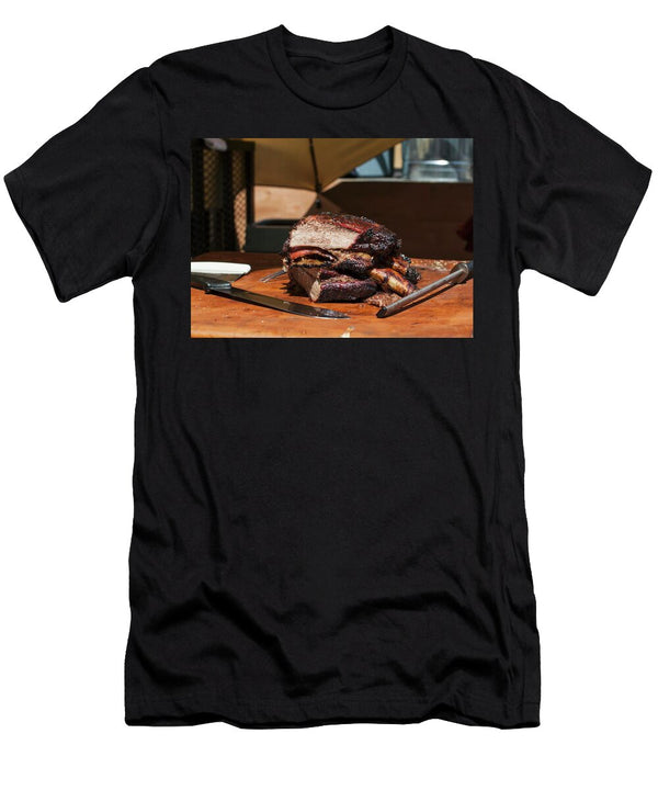 Barbequed Beef Ribs Stacked on a Cutting Block in the Sun with a Carving Knife and Sharpening Tool Don Crossland T-Shirt