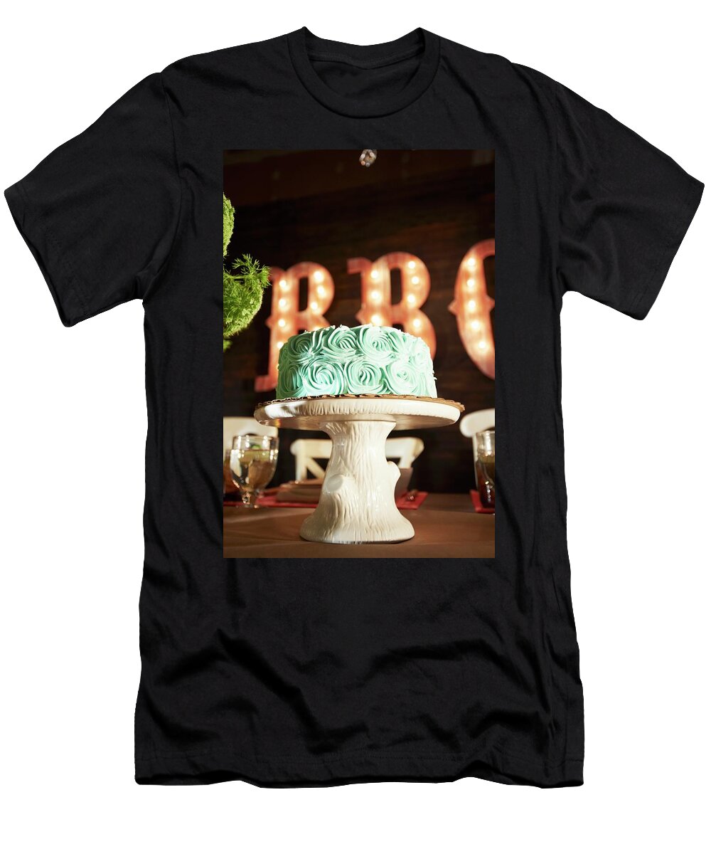 Chocolate Cake with Green Icing on a Faux Wood Cake Stand on a Table in a Barbecue Restaurant Rannells Greg T-Shirt