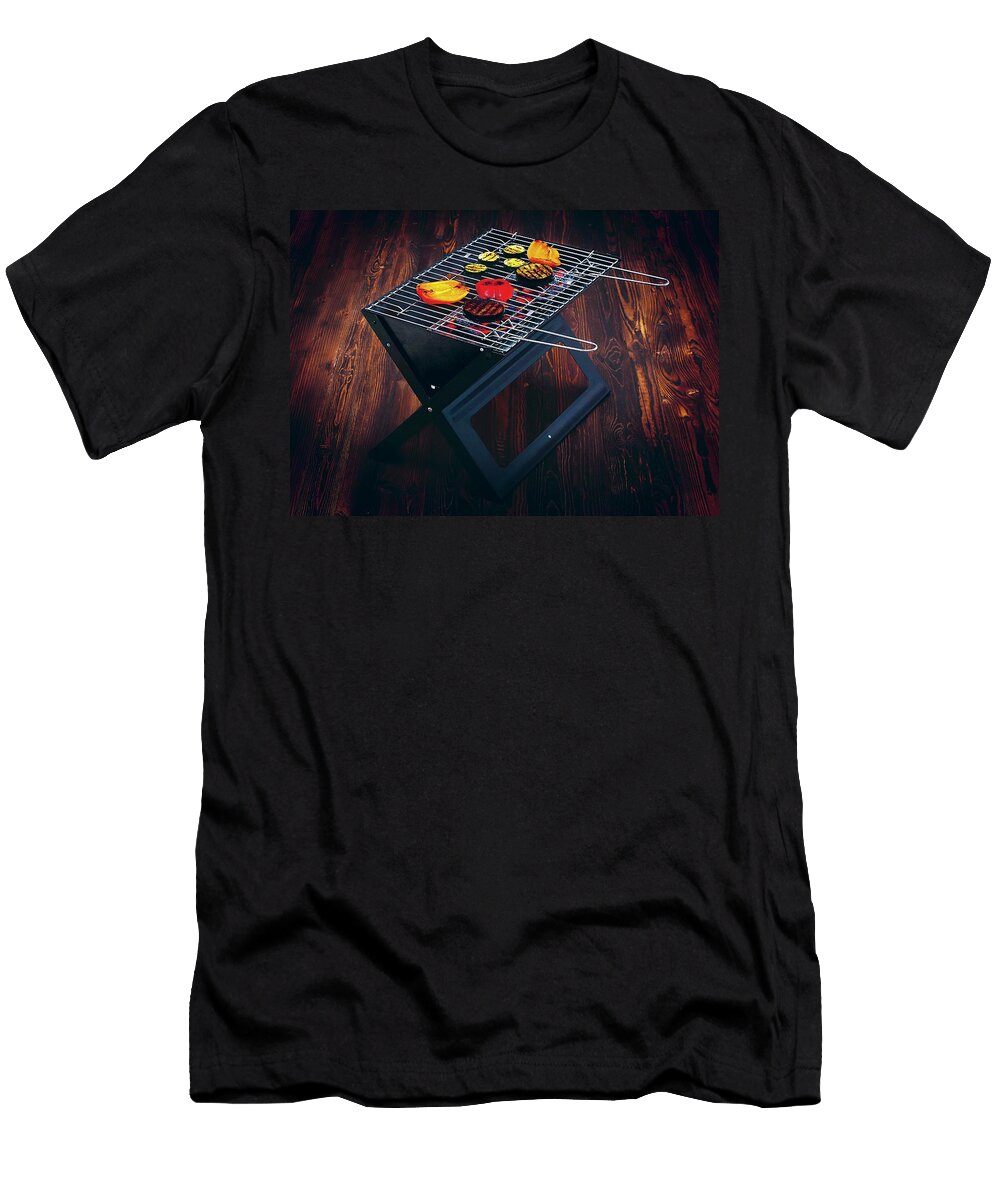 Food on a Folding Grill on a Dark Wooden Surface Jalag Michael Bernhardi T-Shirt