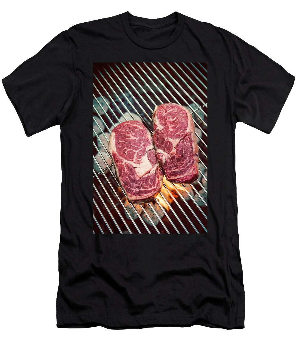 Raw Ribeye Steaks on a Grill Jan Wischnewski T-Shirt