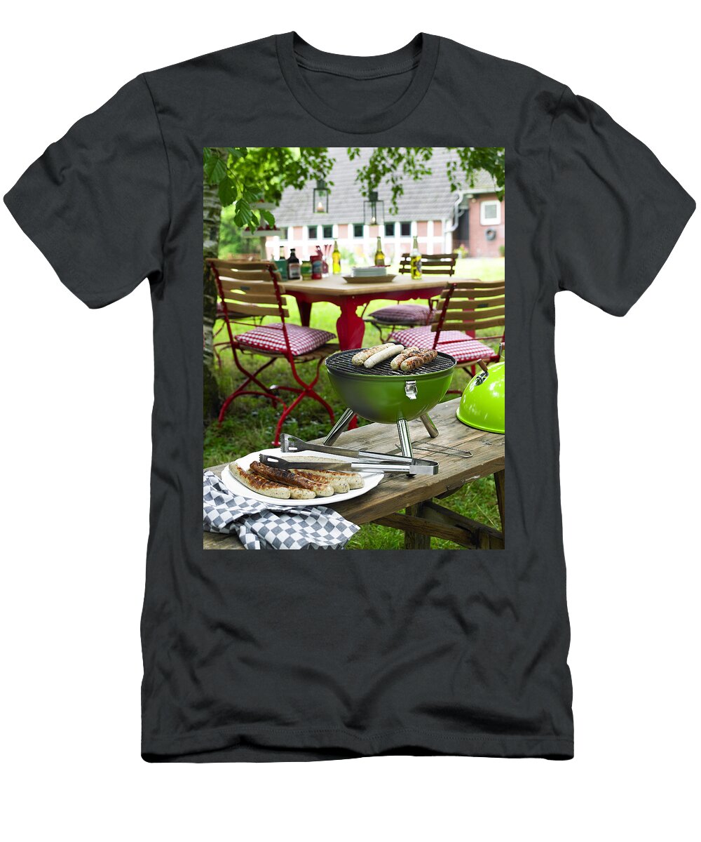 Sausages on Plate and Kettle Grill on Bench Jalag Olaf Szczepaniak T-Shirt