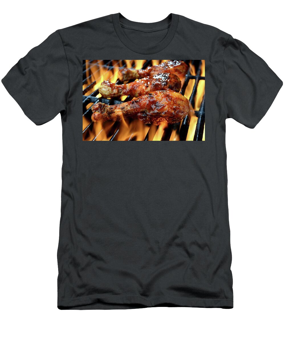 Three Chicken Legs in Bbq Sauce Cooking on a Flaming Grill Brian Enright T-Shirt