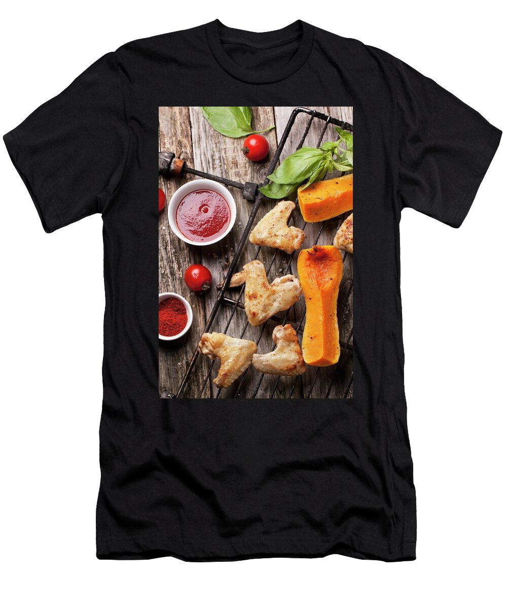 Top View on Grilled Chicken Wings and Pumpkin on Old Grill Served with Tomato Deep and Fresh Basil Over Old Wooden Table Natasha Breen T-Shirt